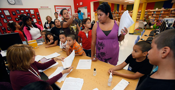 Parents and students line up to receive vaccines at Broadmoor Elementary School in Miami. (AP/Wilfredo Lee)