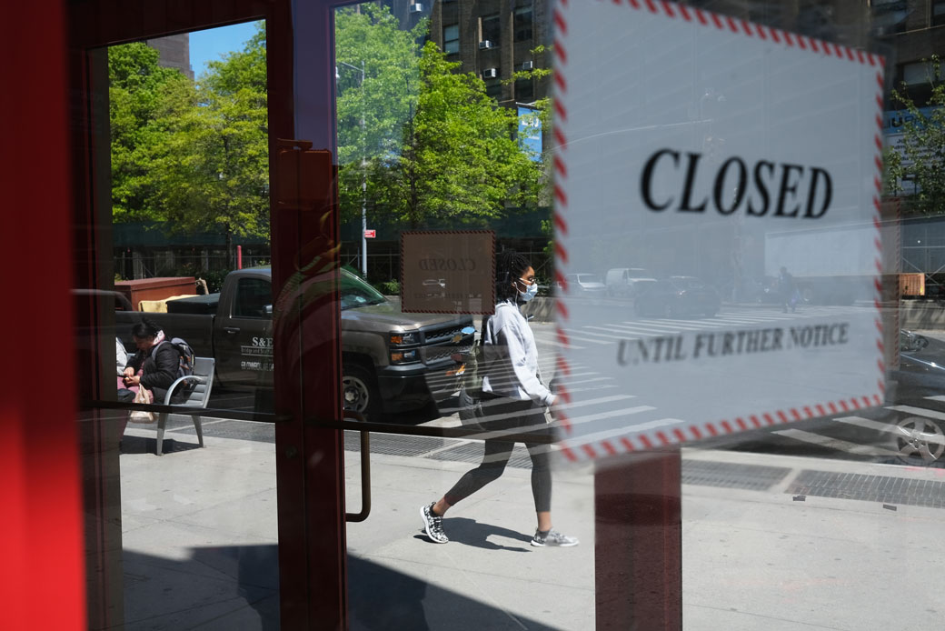 People walk through a shuttered business district in New York on May 12, 2020. (Getty/Spencer Platt)