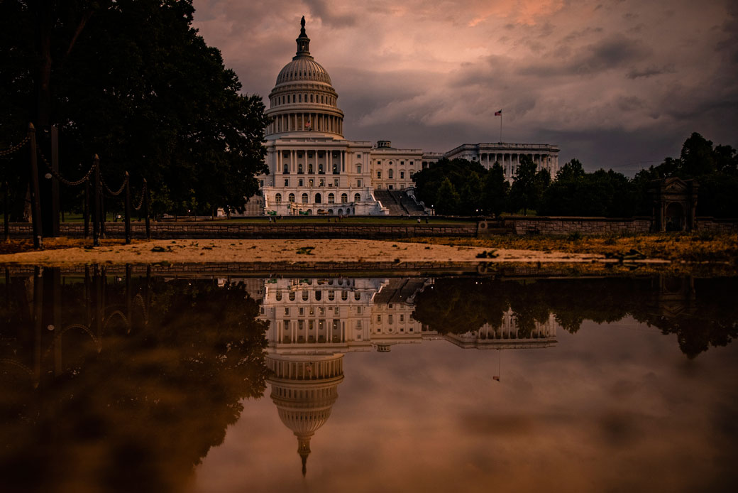 The U.S. Capitol Building is seen as the sun sets and a heavy thunderstorm forms over Washington, D.C., on July 26, 2021. (Getty/Samuel Corum)
