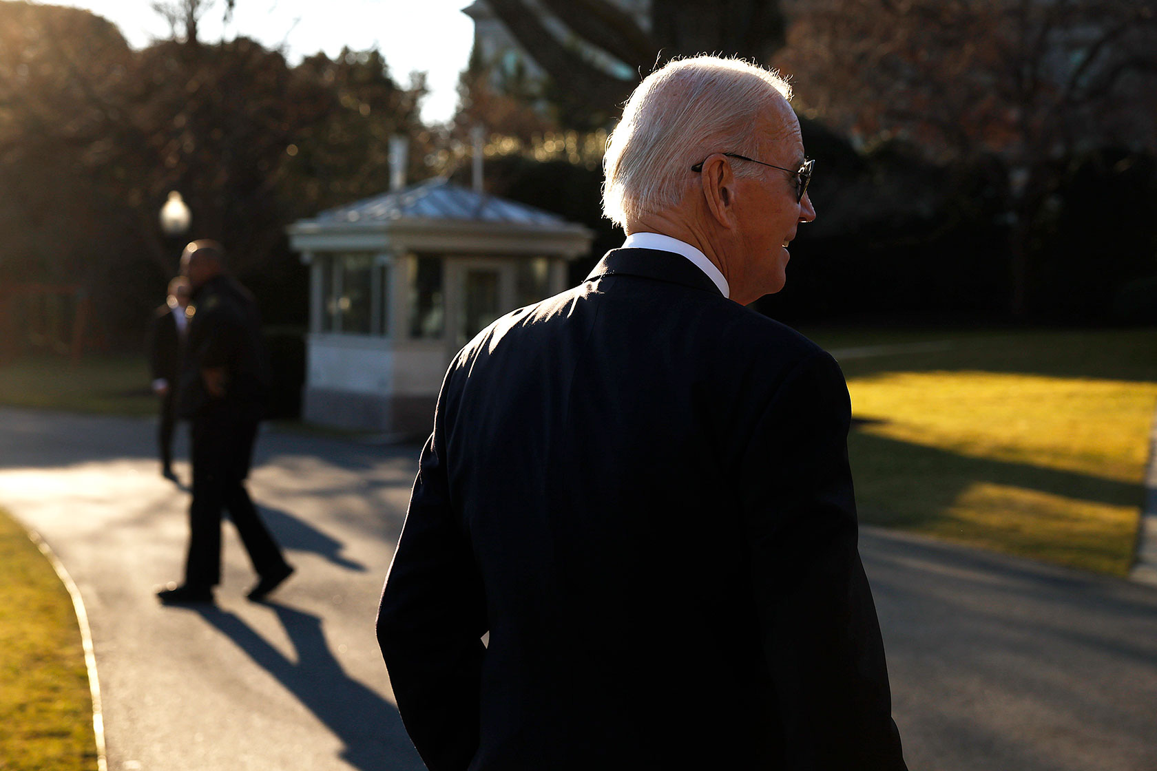 U.S. President Joe Biden talks to reporters after returning to the White House.