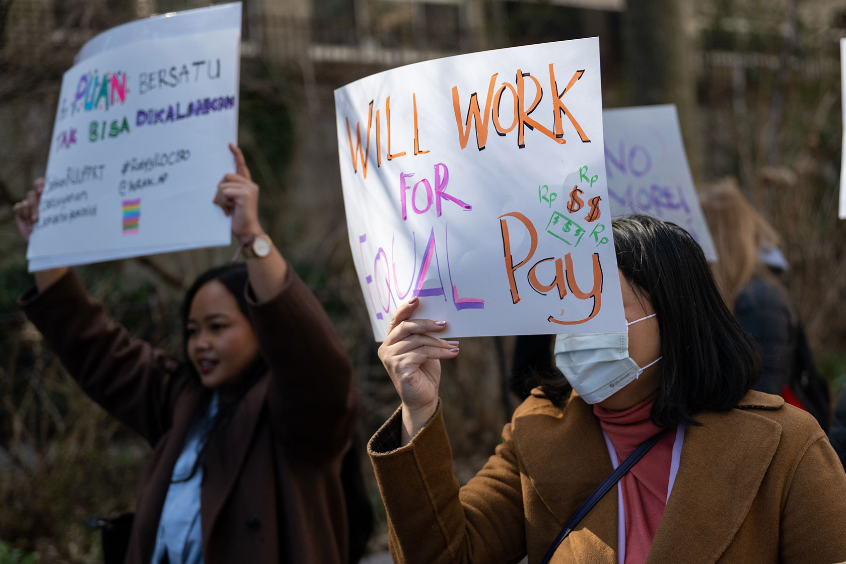 Women protest for equal pay at a rally on International Women’s Day outside the United Nations building.