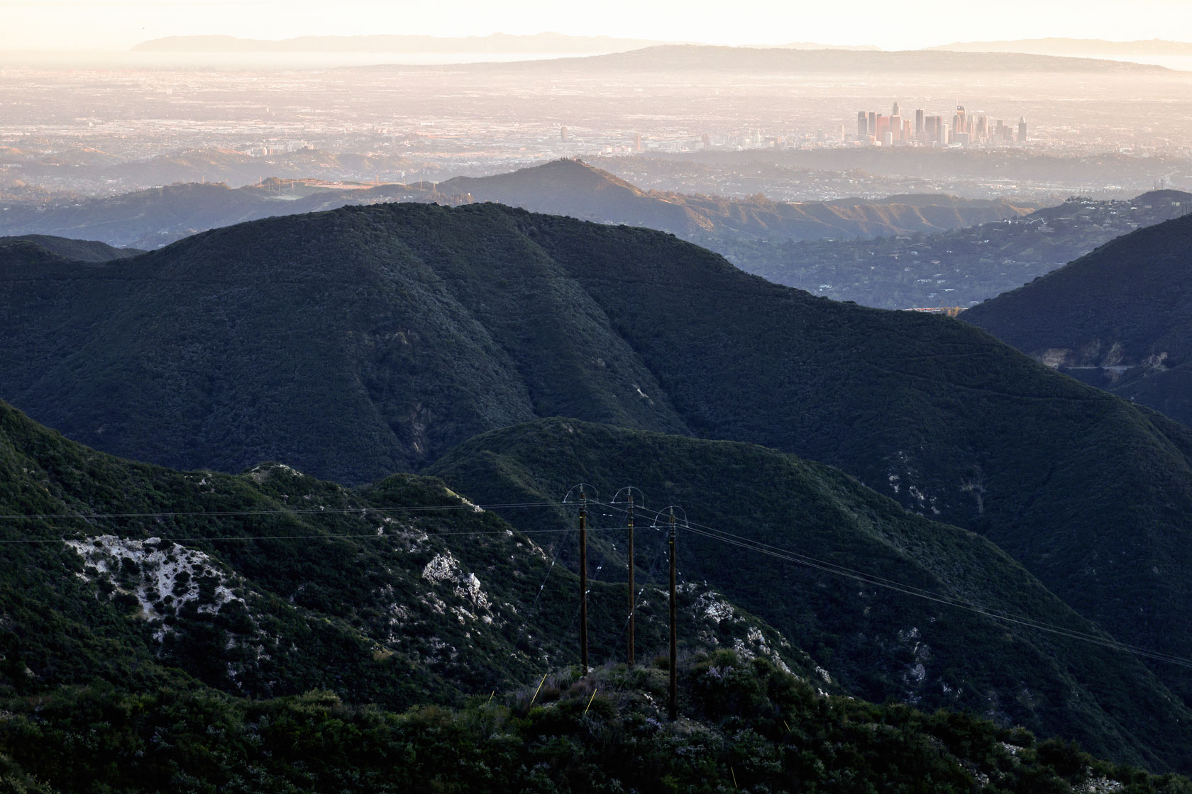 A view of the San Gabriel Mountains National Monument, with downtown Los Angeles visible in the background.