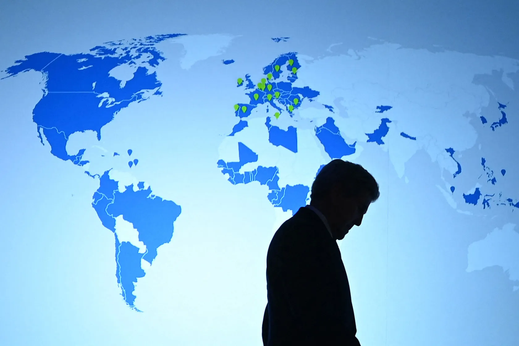 U.S. Special Presidential Envoy for Climate John Kerry arrives on stage to deliver a speech.